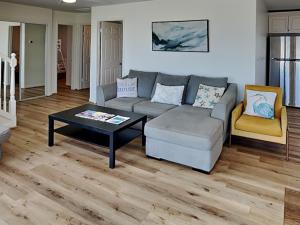 a living room with a couch and a coffee table at Our Infinity Pool in Galveston