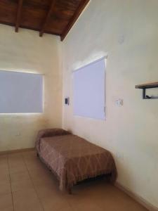 Ένα ή περισσότερα κρεβάτια σε δωμάτιο στο Cabaña La Kalma