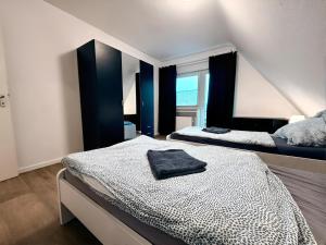 Ένα ή περισσότερα κρεβάτια σε δωμάτιο στο Apartment Am Hang II Natur & Ruhe