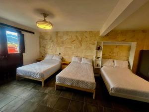 En eller flere senge i et værelse på LA ESTANCIA, Casa EA Oaxaca, Centro Histórico, Balcón a las Montañas