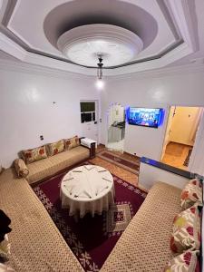 a living room with a couch and a table at Tumsilt in Marrakesh