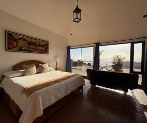 Postel nebo postele na pokoji v ubytování Vista Encantada Hotel