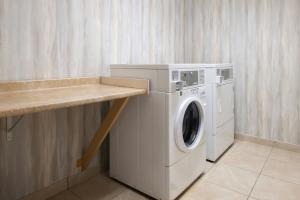 a washer and dryer in a laundry room at Courtyard Carson City in Carson City