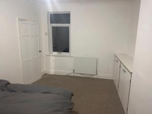 En eller flere senge i et værelse på hougton