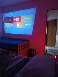 TV a/nebo společenská místnost v ubytování Aconxeguinho