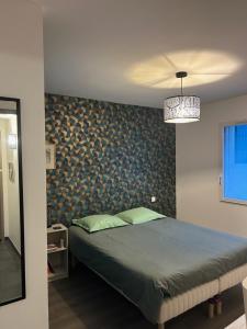 Postel nebo postele na pokoji v ubytování Chez Olivier et Damien