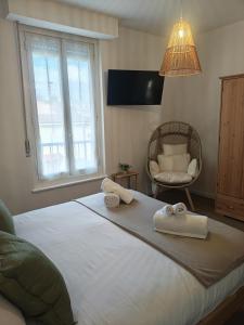 a bedroom with a large bed with towels on it at Terrazza Groane in Garbagnate Milanese