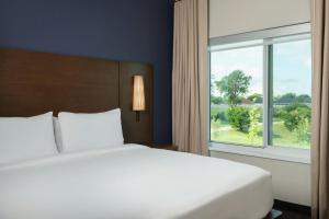 a bedroom with a large bed and a window at Residence Inn Pearland in Pearland +29 photos
