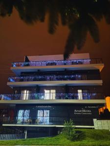 a building with a lot of lights on it at Aparthotel Green Concrete in Świnoujście