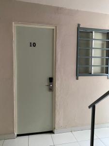 a white door in a room with a window at Habitacion C10 privada centro monterrey in Monterrey +1 photo