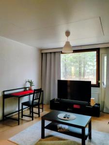 Χώρος καθιστικού στο Rivitalohuoneisto, Kinnula