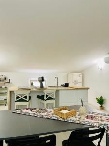 a kitchen with a table and a counter top at PsApart in Augusta