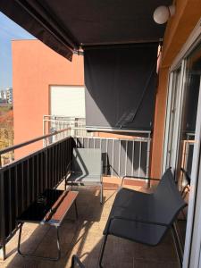 a balcony with a large screen on a building at Apartman *Joy* in Osijek
