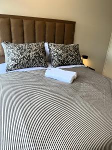 Postel nebo postele na pokoji v ubytování Condominio Beauchef 1916