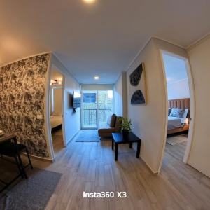 Postel nebo postele na pokoji v ubytování Condominio Beauchef 1916