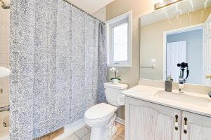 a bathroom with a toilet and a sink and a shower at The Urban Family Pad in Toronto +19 photos