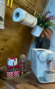 a bathroom counter with a toilet paper roll and a toaster at Cabana Zeneris in Vulcana de Sus +148 photos