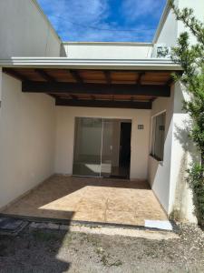 a view of a house with a patio at Quarto com ar banheiro frigobar in Sinop