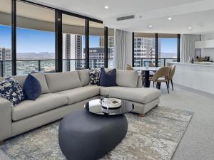 a living room with a couch and a table at Oceanview Luxury Escape Oracle Tower 2 Level 24 in Gold Coast