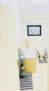 a bathroom with a sink and a toilet at Graceful Getaway Air B&B in Rundu +16 photos