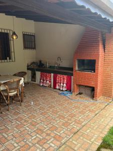 Billede fra billedgalleriet på Casa com Espaço Gourmet e Piscina a 2min da Praia i Caraguatatuba