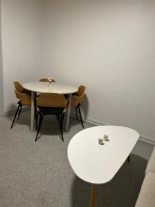 a white table and chairs in a room at Kiko in Horsens