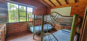 Ένα ή περισσότερα κρεβάτια σε δωμάτιο στο Finca Piscina Playita Kiosco Bar Combia - Estación Pereira