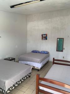 Ένα ή περισσότερα κρεβάτια σε δωμάτιο στο Pousada em Jacumã PB +7 φωτογραφίες