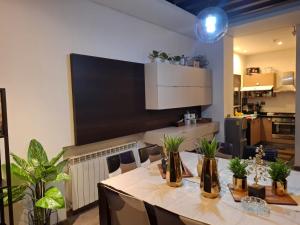 a kitchen with a table with plants on it at LES Dunes De Faqra ( c duplex ) in Abū Mīzān
