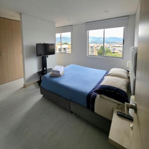 Una cama o camas en una habitación de Ejecutivo con vista natural, Parking, Wifi, Cajicá