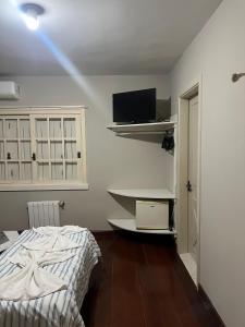 Μια τηλεόραση ή/και κέντρο ψυχαγωγίας στο Hospedagem Solari di Gramado +26 φωτογραφίες