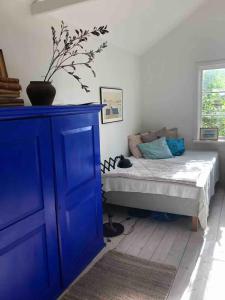 Ένα ή περισσότερα κρεβάτια σε δωμάτιο στο Nordisk Sommerhus I Nykøbing Sjælland