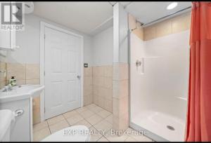 a bathroom with a shower and a toilet and a sink at Luxurious home in Belleville in Bélanger +19 photos