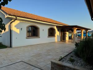 a white house with a patio at R Limoli Vintage in Trávnica