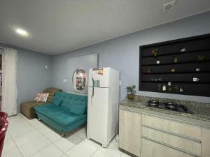 Η κουζίνα ή μικρή κουζίνα στο Casa com ar condicionado