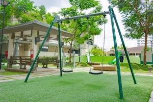 an empty swing set in a park at Meraki Urban in Davao City