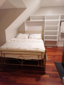 a bedroom with a bed in the attic at Beautiful home with your own entrance in Sandy in Sandy