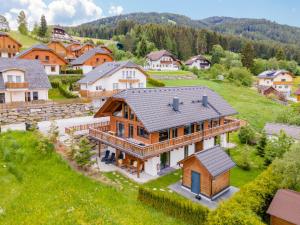 an aerial view of a large wooden house at Alpinn Wellness 1 in Sankt Margarethen im Lungau