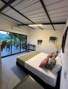 Postel nebo postele na pokoji v ubytování Cabañas Flor Del Monte