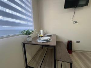 Et tv og/eller underholdning på bulnes urbano suites 1