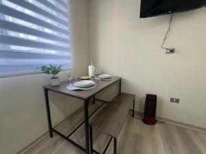 Et tv og/eller underholdning på bulnes urbano suites 1