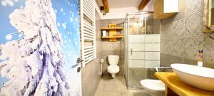 Et badeværelse på Bilocale Nel Cuore Della Val Di Fiemme