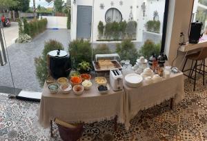 a table with food on it in a room at ฌอณบูติค Shon Boutique in Ban Nong Nam Khan +28 photos