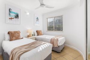 a bedroom with two beds and a window at 'Villa Mar Colina U12' Coastal Escape, Yeppoon in Yeppoon +9 photos