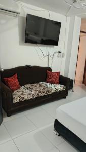 Μια τηλεόραση ή/και κέντρο ψυχαγωγίας στο Apartamento Ideal a 7 minutos de la playa