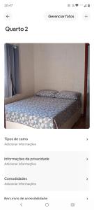 a picture of a bed in a room at Casa do refúgio melhor para suas férias in Palhoça