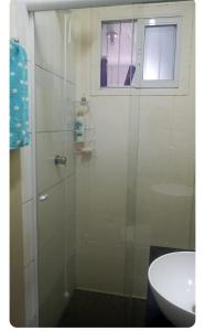 a glass shower in a bathroom with a sink at Casa do refúgio melhor para suas férias in Palhoça +5 photos