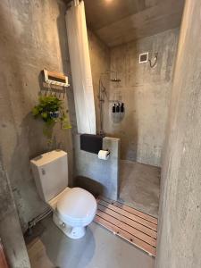 a bathroom with a toilet and a shower at Stäy Hotel Nakijin in Nakijin +45 photos