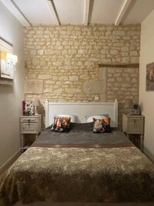 Ένα ή περισσότερα κρεβάτια σε δωμάτιο στο Ecole de Mathuna de Marigny Brizay +99 φωτογραφίες