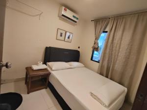 Ένα ή περισσότερα κρεβάτια σε δωμάτιο στο HOTEL NoVA